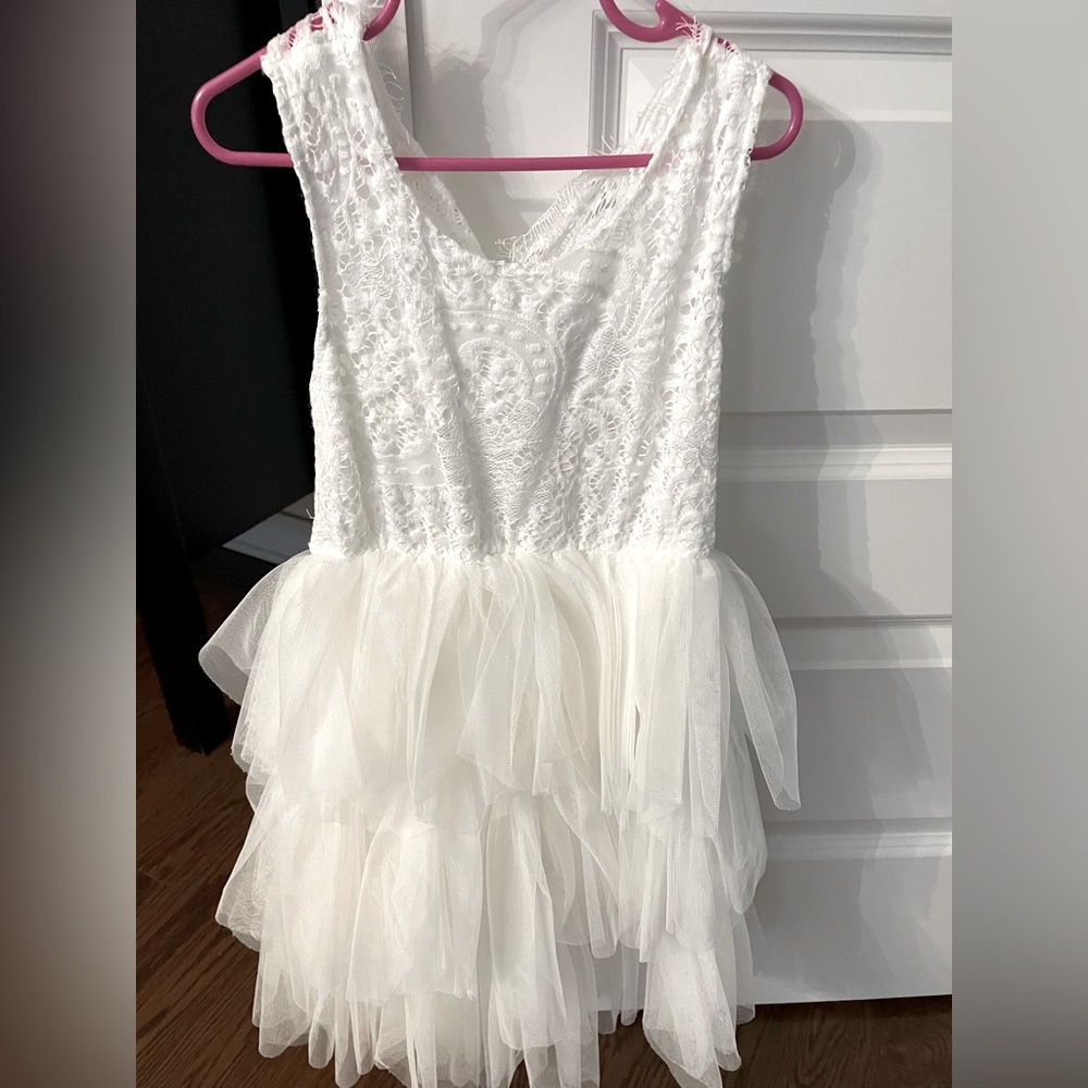 Flower girl dress with big bow on back.